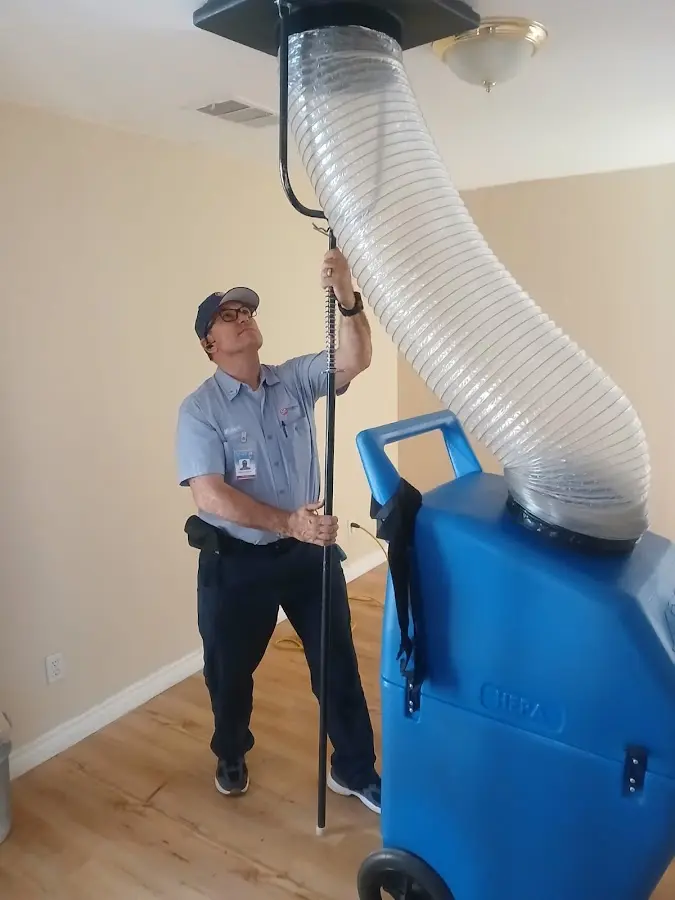 Furnace Tune-Up technician using HEPA equipment in Ocean City